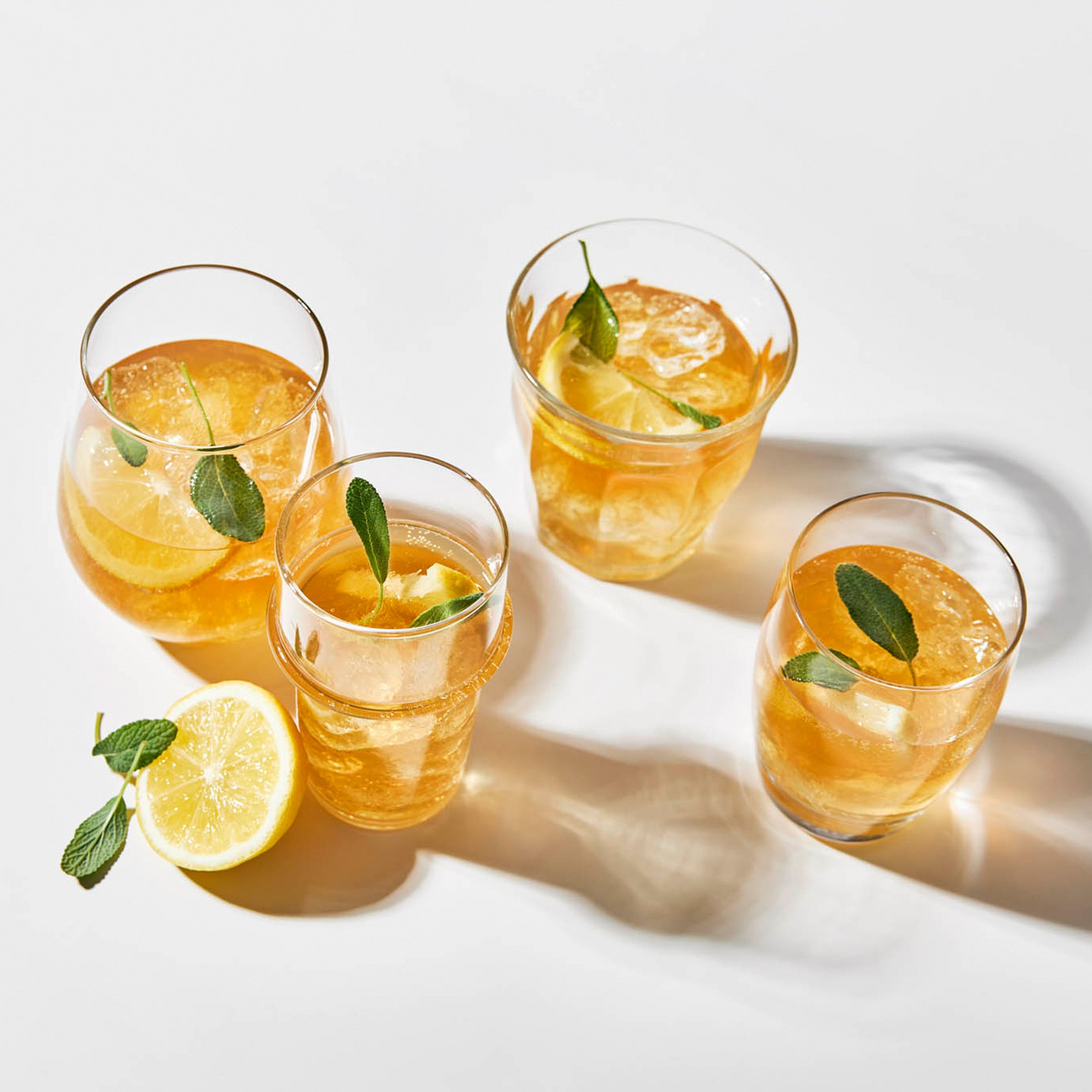 Iced citrus drinks with lemon and herbs served as a caffeine-free alternative to coffee