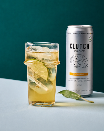 CLUTCH Mindset Mango Lemon caffeine-free focus drink beside an iced citrus drink
